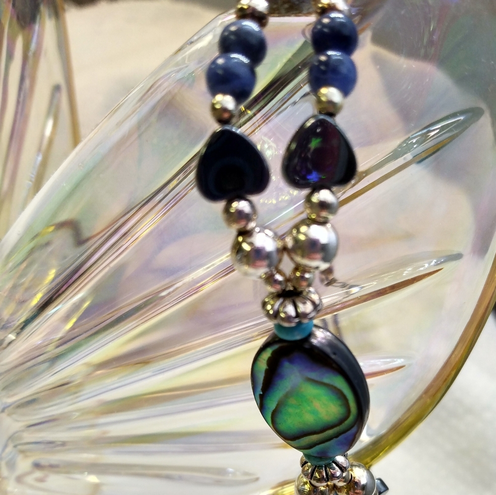 Women's multi stone bracelet with silver tone accents. 8". Good used condition. - Picture 8 of 11